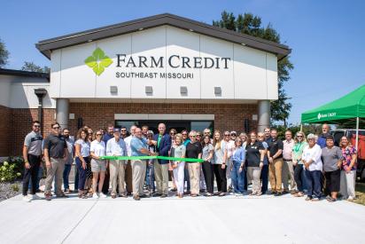 Farm Credit Southeast Missouri staff gather in front of the new Kennett Branch Office Building for the official ribbon cutting ceremony. 